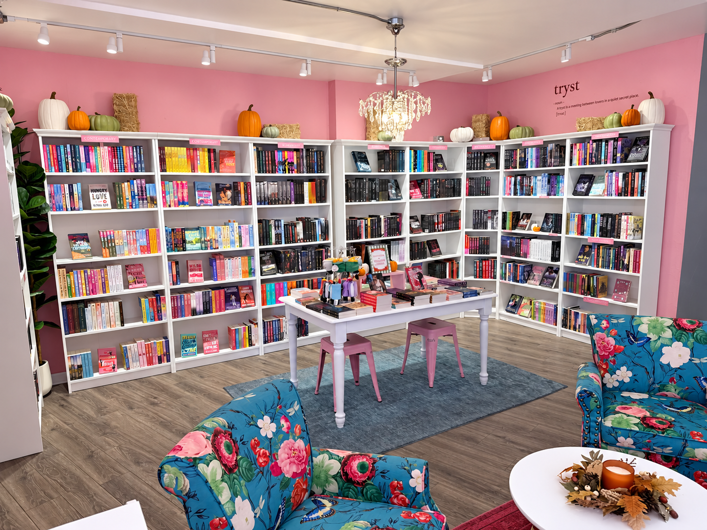 Pink walls, romance-filled bookshelves and floral armchairs inside Tryst bookstore
